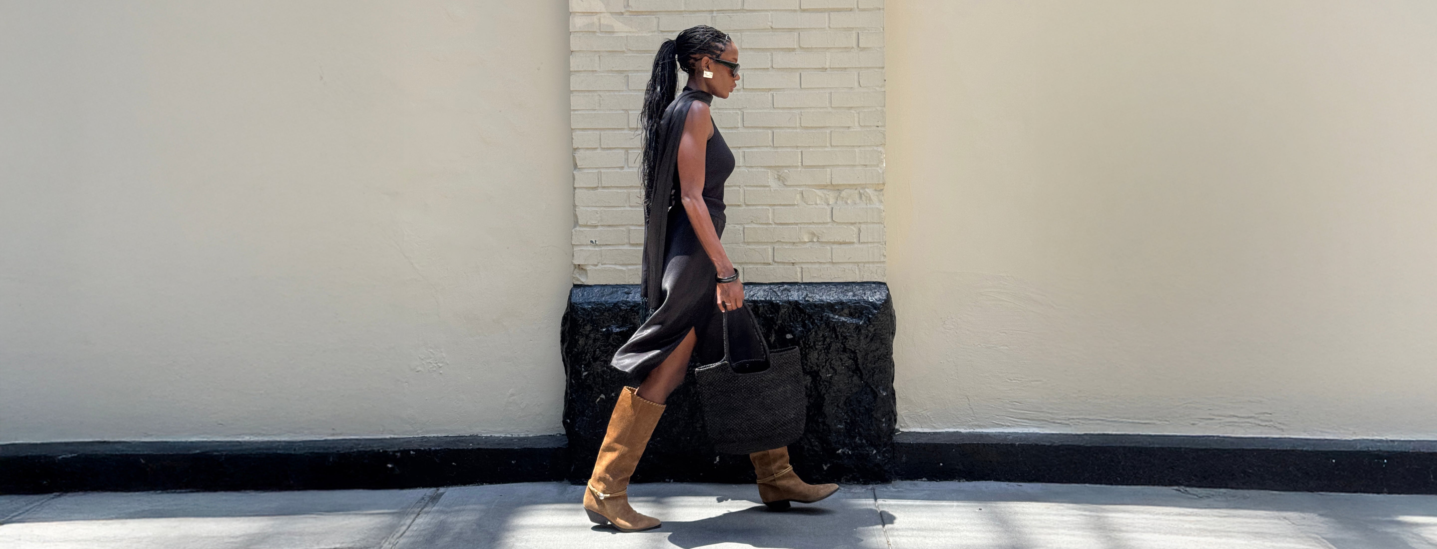 Editorial banner featuring model wearing boots