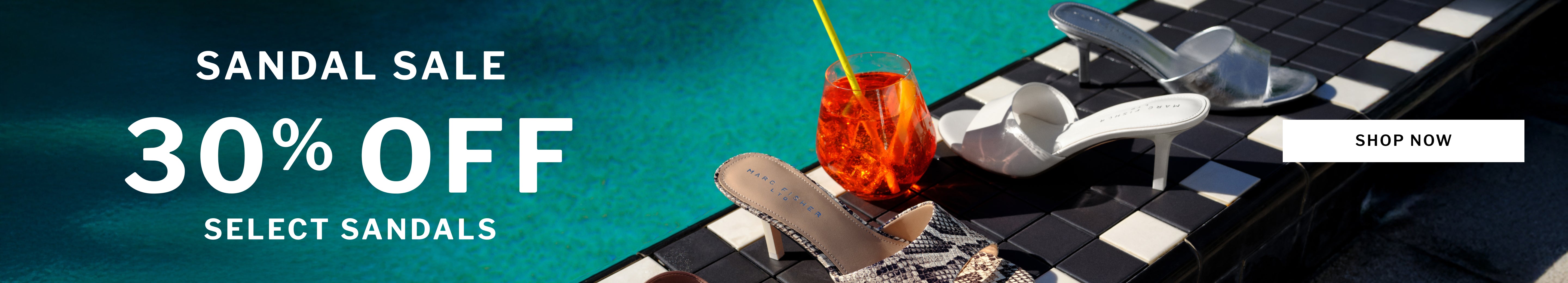 Promotional banner for a sandal sale with large white text reading 'SANDAL SALE 30% OFF SELECT SANDALS' over a tropical poolside scene. Several heeled sandals are shown on a dark tiled deck beside turquoise water, with an orange cocktail glass and a white 'SHOP NOW' button.