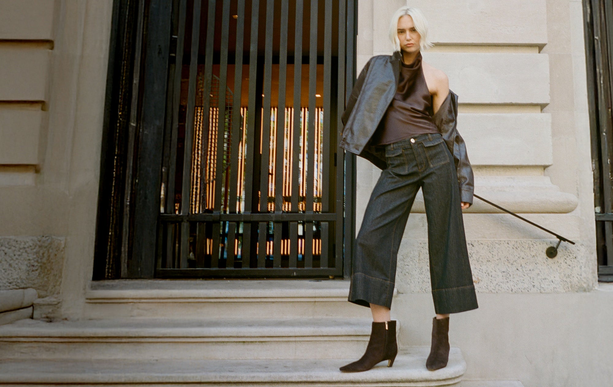 Editorial banner featuring model wearing Danai Kitten Heel Leather Ankle Bootie