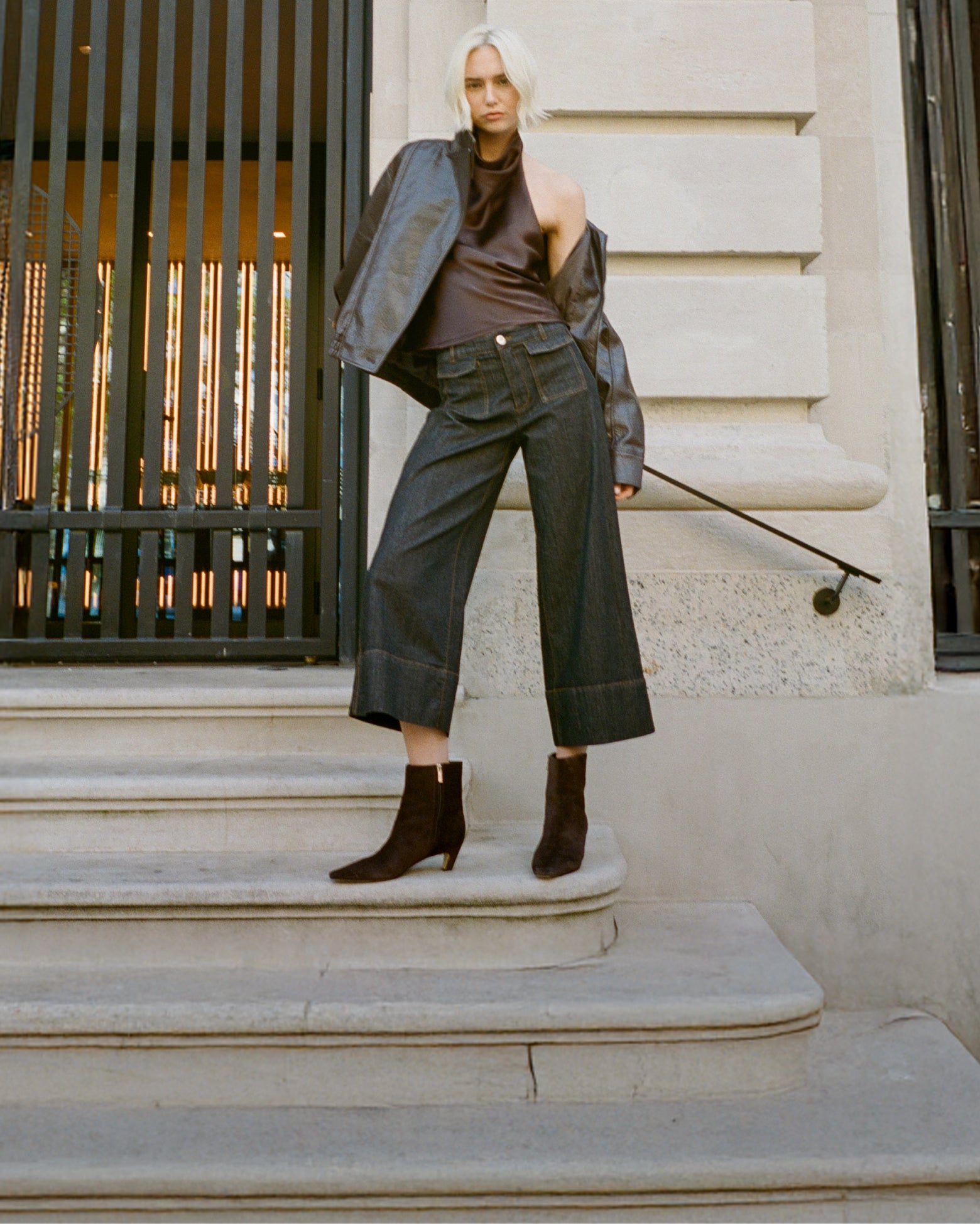 Editorial banner featuring model wearing Danai Kitten Heel Leather Ankle Bootie