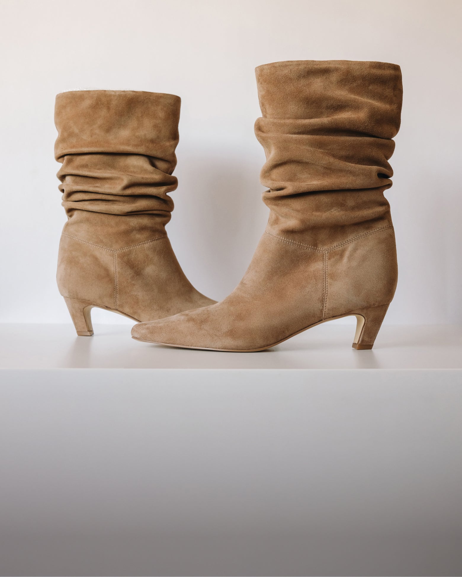 Editorial banner featuring slouch boots